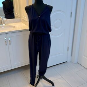 Ladies Navy Blue V neck Jumpsuit with tie cinched waist. Size S.